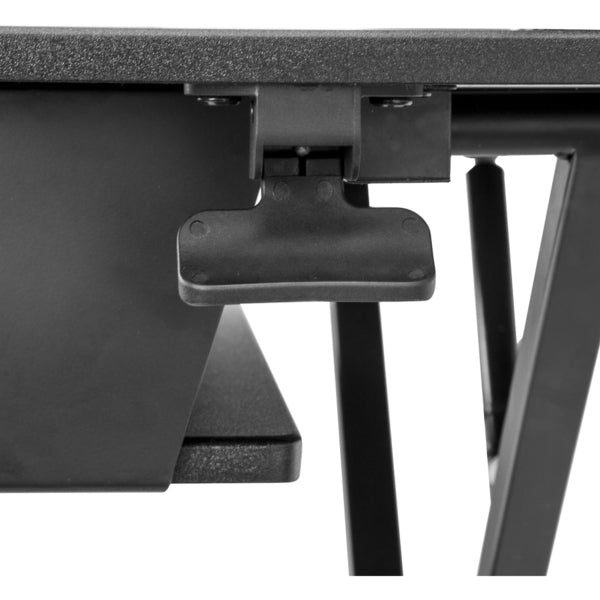 A StarTech.com Sit Stand Desk Converter - Keyboard Tray - Height Adjustable Ergonomic Desktop/Tabletop Standing Desk - Large 35"x21" Surface with a laptop on top.