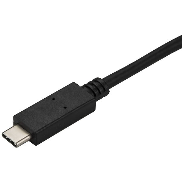 A black StarTech.com 9.8ft/3m USB C to DisplayPort 1.2 Cable 4K 60Hz - USB Type-C to DP Video Adapter Monitor Cable HBR2 - TB3 Compatible - Black connected to a computer.