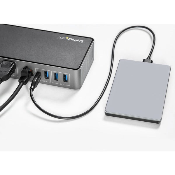 A computer with a Star Tech.com USB-C &amp; USB-A Dock - Hybrid Triple Monitor Laptop Docking Station DisplayPort &amp; HDMI 4K 60Hz/85W PD/6x USB/GbE/USB 3.1 Gen 2 connected to it.