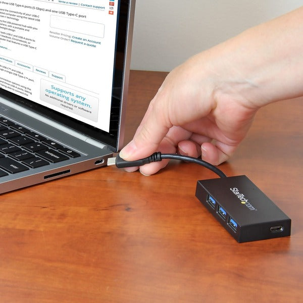 A StarTech.com USB C Hub - 4 Port USB-C to USB-A (3x) and USB-C (1x) - Bus Powered USB Hub - USB Type C Hub - Port Expander with two usb ports.