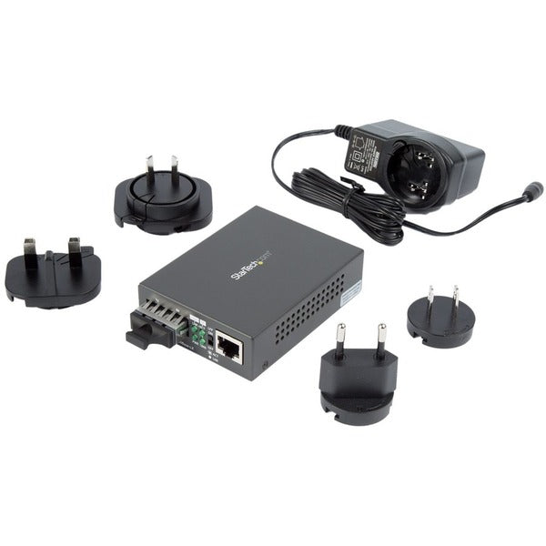 A StarTech.com Multimode SC Fiber Ethernet Media Converter - 1000BASE-SX Gigabit Fiber Optic to Copper Bridge - 10/100/1000 Network - 550m on a white background.