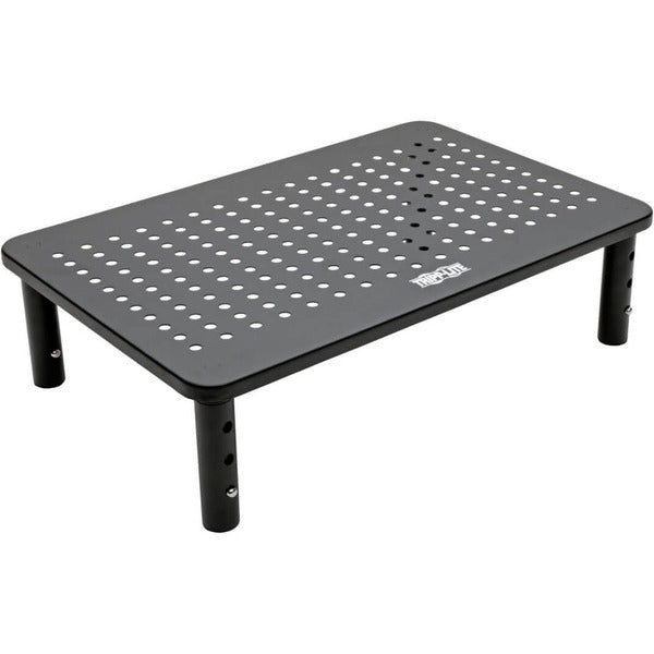 A Tripp Lite Monitor Riser Stand Desktop Metal Height Adjustable Black 14 x 9in with a set of tools on it.
