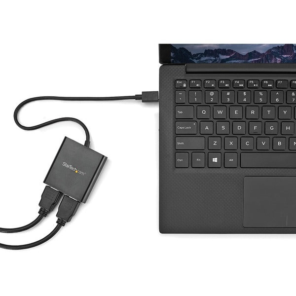 A StarTech.com 2-Port Multi Monitor Adapter - USB-C to HDMI Video Splitter - USB Type-C to HDMI MST Hub - Thunderbolt 3 Compatible - Windows on a white background.