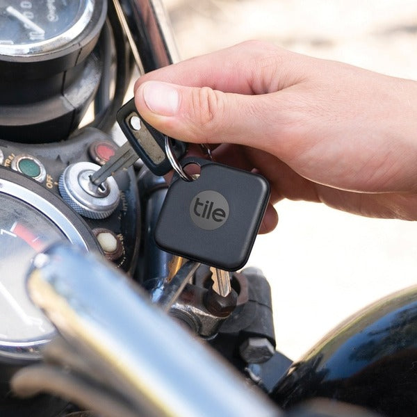 Tile Pro Asset Tracking Device logo on a white background featuring a water-resistant Tile Pro Asset Tracking Device.