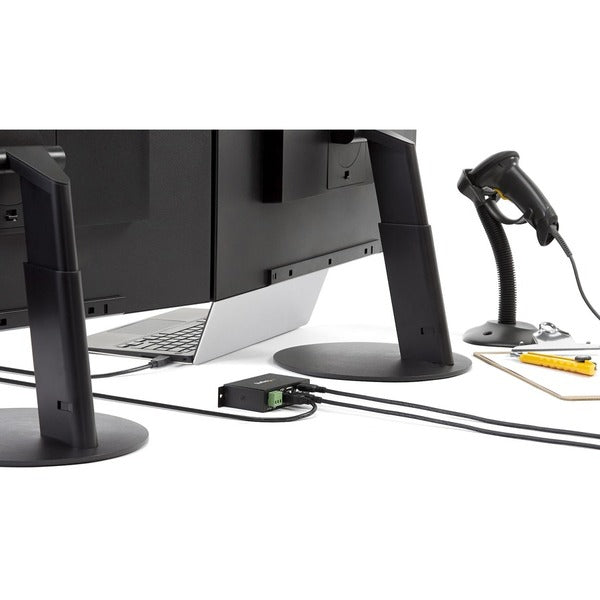A StarTech.com 4-Port USB 2.0 Hub with two holes on it.