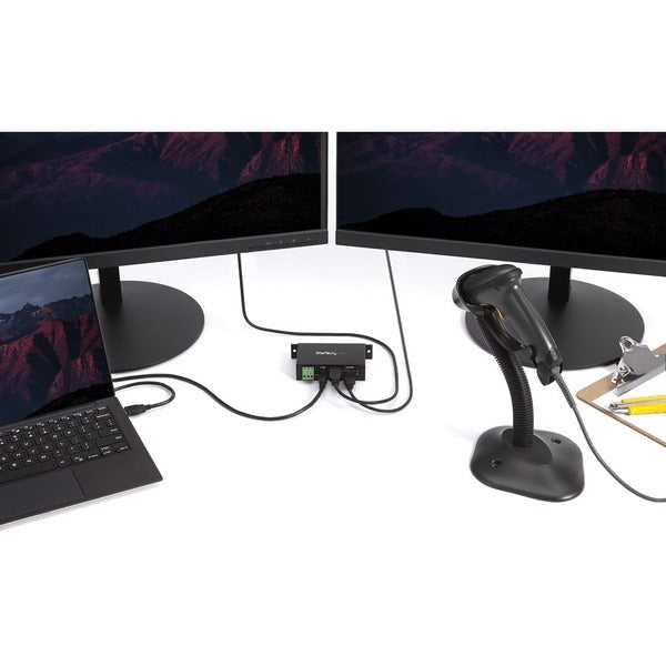A StarTech.com 4-Port USB 2.0 Hub with two holes on it.