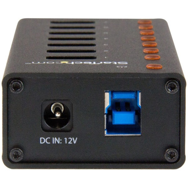 A black StarTech.com 7 Port USB 3.0 Hub - Desktop or Wall-mountable Metal Enclosure with four ports.