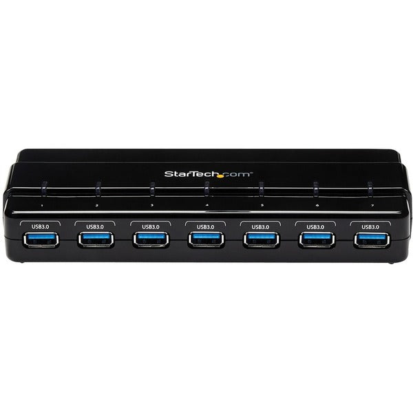 A StarTech.com 7 Port SuperSpeed USB 3.0 Hub - Desktop USB Hub with Power Adapter in black with six ports.