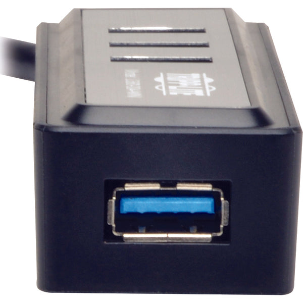The Tripp Lite Portable 4-Port USB 3.0 Superspeed Mini Hub w/ Built In Cable is connected to a computer.