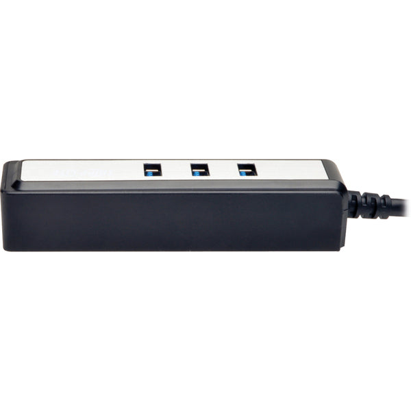 The Tripp Lite Portable 4-Port USB 3.0 Superspeed Mini Hub w/ Built In Cable is connected to a computer.