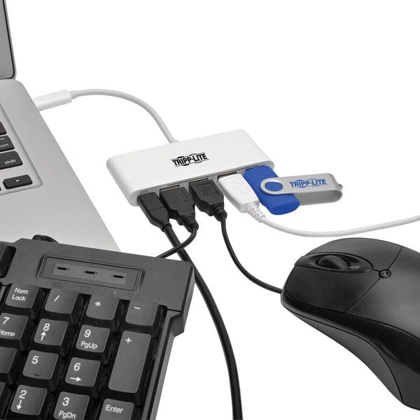 Two Tripp Lite 4-Port USB 3.1 Gen 1 Portable Hubs, USB-C to (x4) USB-A, with USB-C Charging Port on a white surface.