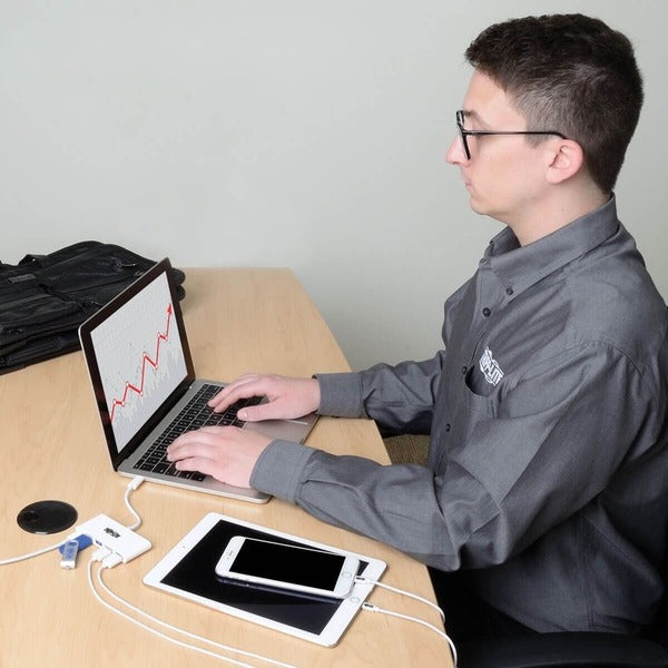 Two Tripp Lite 4-Port USB 3.1 Gen 1 Portable Hubs, USB-C to (x4) USB-A, with USB-C Charging Port on a white surface.