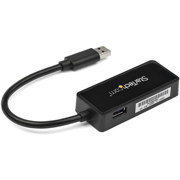 A StarTech.com USB 3.0 to Gigabit Ethernet Adapter NIC w/ USB Port - Black connected to a computer.
