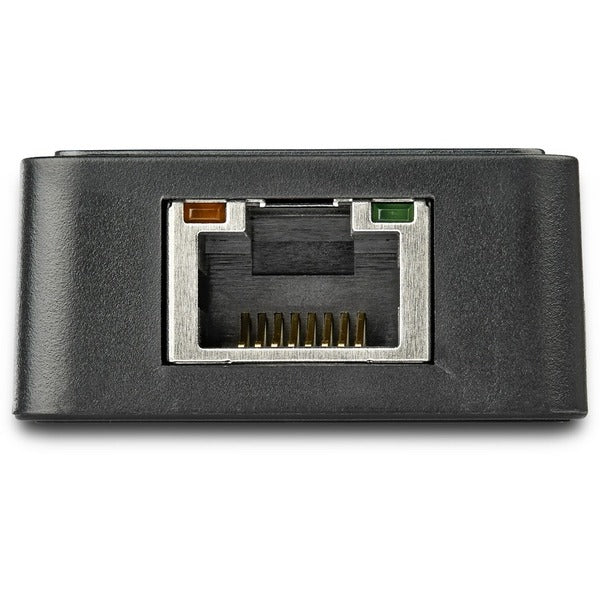 A StarTech.com USB 3.0 to Gigabit Ethernet Adapter NIC w/ USB Port - Black connected to a computer.