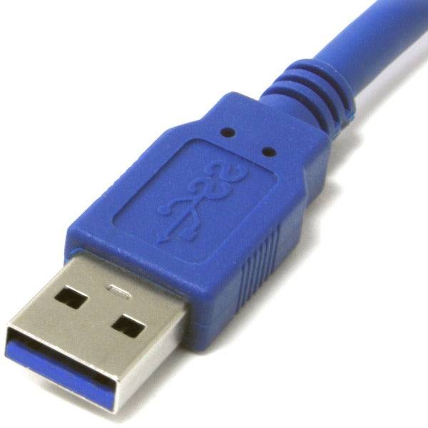 A blue StarTech.com 1 ft SuperSpeed USB 3.0 Cable A to Micro B connected to a white surface.