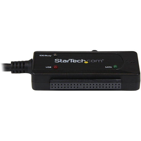 A StarTech.com USB 3.0 to SATA or IDE Hard Drive Adapter Converter connected to a computer.