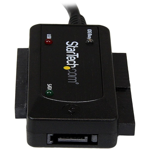 A StarTech.com USB 3.0 to SATA or IDE Hard Drive Adapter Converter connected to a computer.