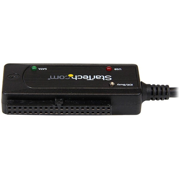 A StarTech.com USB 3.0 to SATA or IDE Hard Drive Adapter Converter connected to a computer.