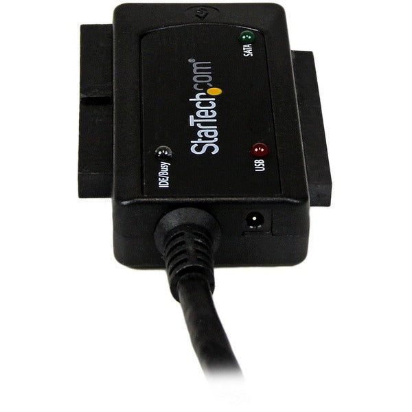 A StarTech.com USB 3.0 to SATA or IDE Hard Drive Adapter Converter connected to a computer.