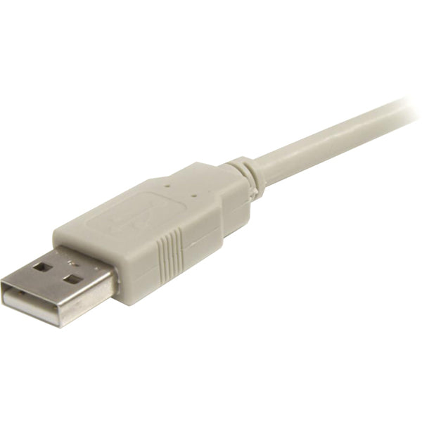 A beige StarTech.com 6 ft USB 2.0 Extension Cable A to A - M/F connected to a computer.