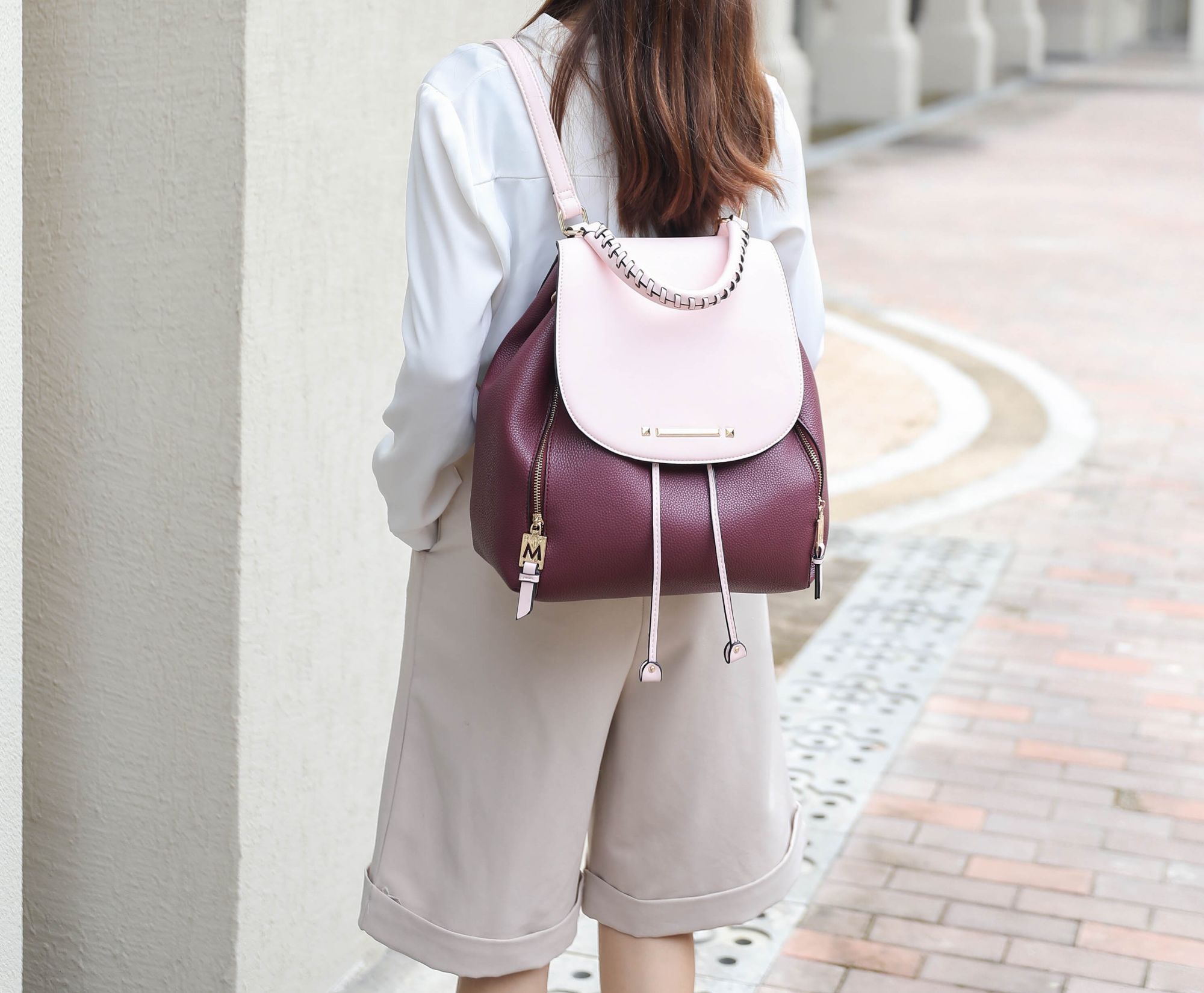 A brown and beige MKF Collection Kimberly Backpack Vegan Leather Women by Mia k with zippers.