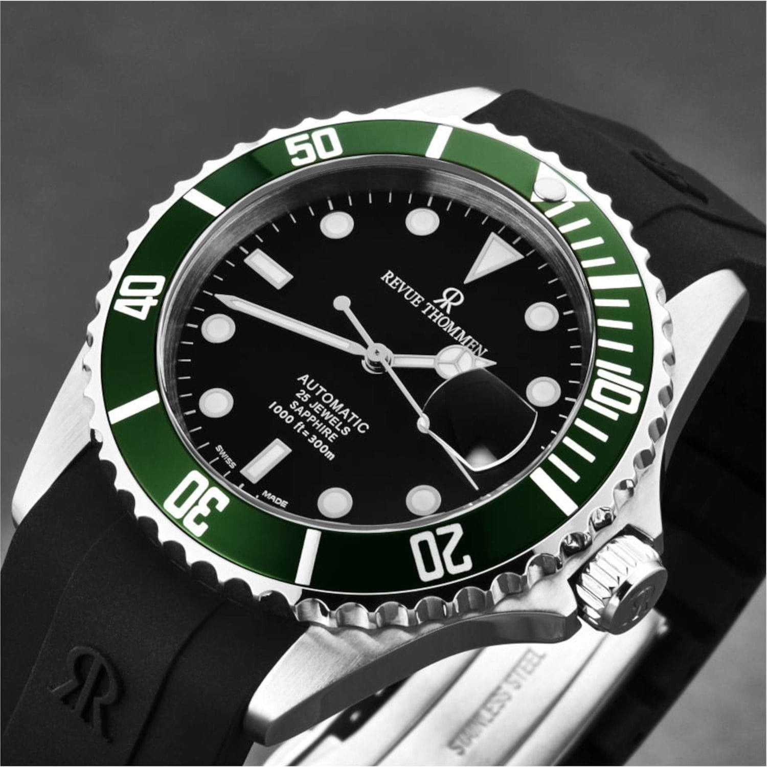 A Revue Thommen 17571.2834 men's 'Diver' Black Dial Rubber Strap Swiss Automatic Watch, featuring a sleek black and green design, showcased against a clean white background.