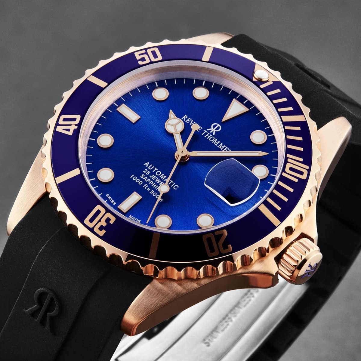 A Revue Thommen Men's 'Diver' Blue Dial Black Rubber Strap Swiss Automatic Watch 17571.2865 with a blue dial and black strap.