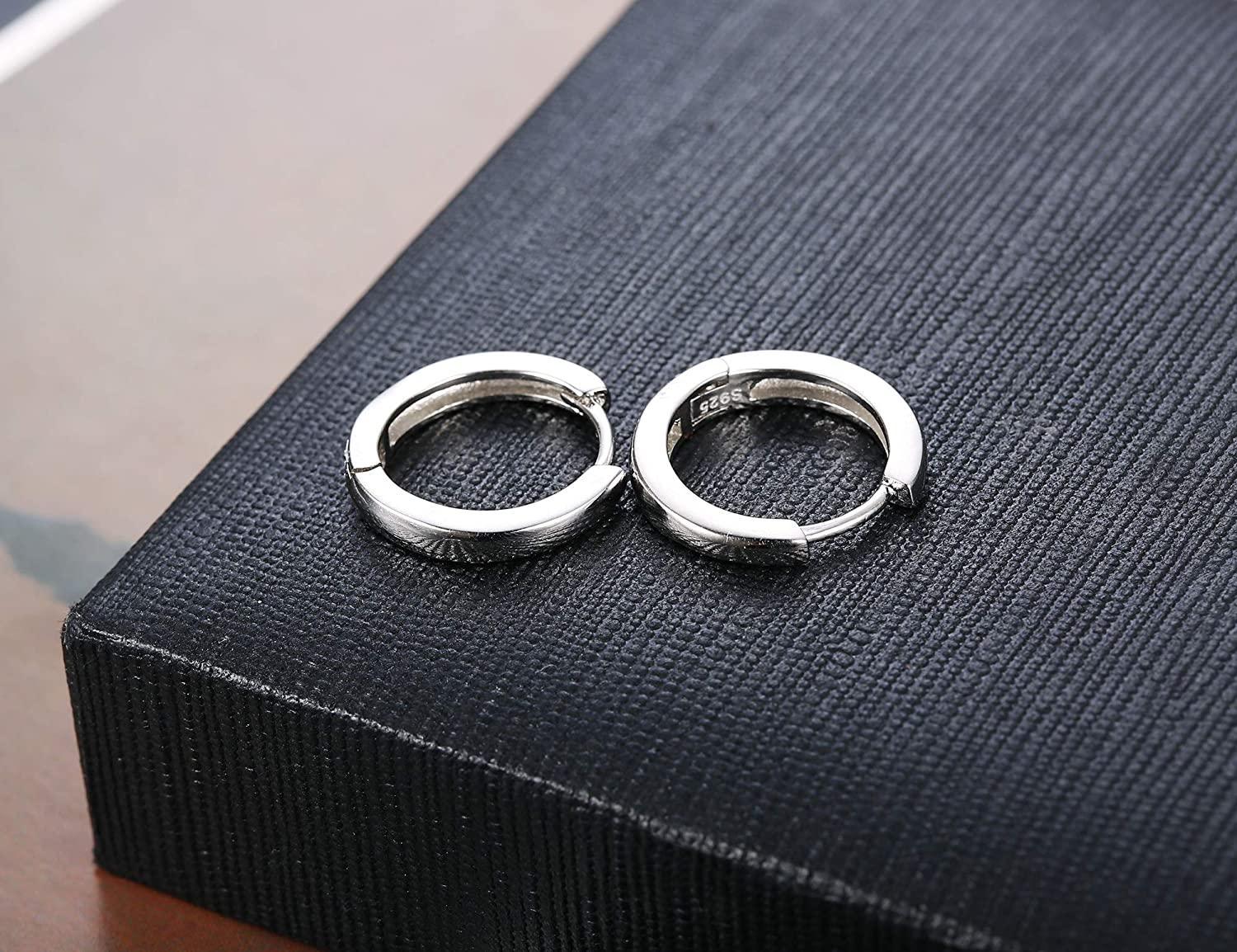 A pair of 925 Sterling Silver Hoop Earrings for Women Men Ear Cuff Small Huggie Earrings Cartilage Piercing Earrings 13mm with a minimalist design, each featuring a small diamond accent at the top.