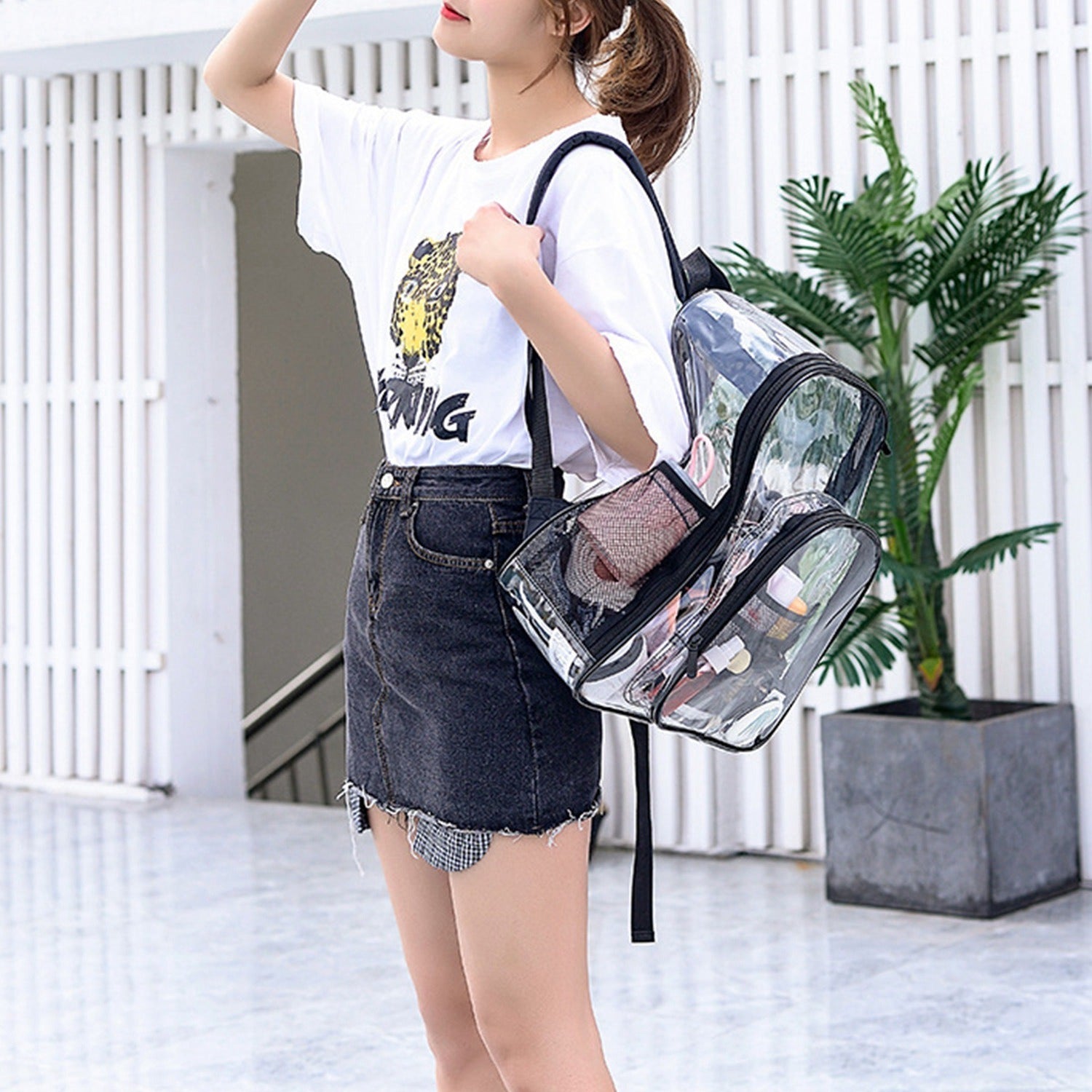 A Clear Backpack Heavy Duty Transparent Book Bag Waterproof PVC Clear Backpack 5.3Gal with Reinforced Strap with adjustable padded straps and spacious compartments, perfect for carrying a lot of items.