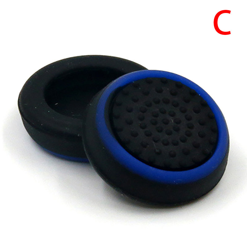 A pair of black and blue rubber grips, known as Luminous handle button mushroom head cover two colors, placed on a white surface. These grips are game console accessories that provide a rocker luminous cap effect.