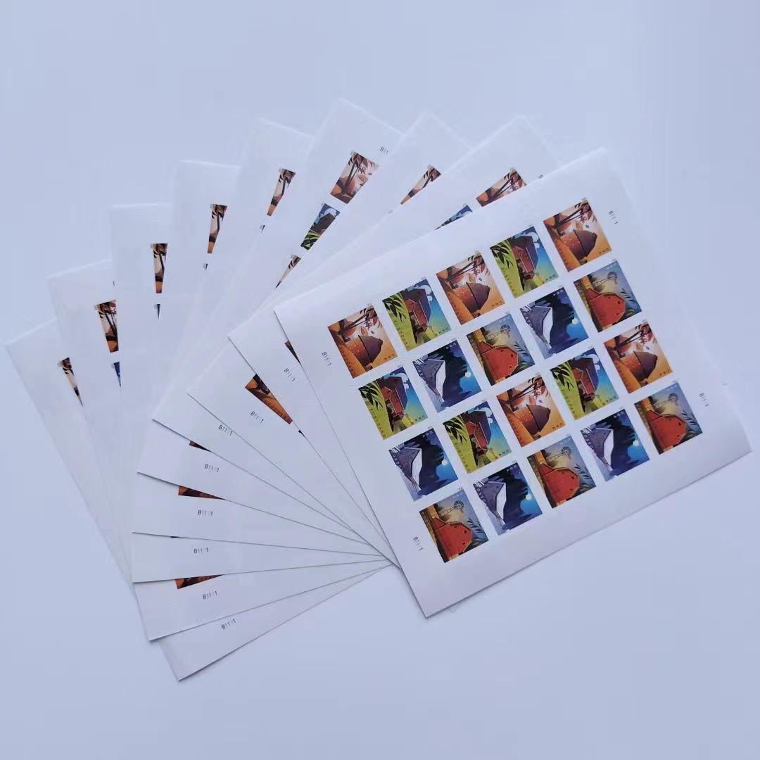 A collection of five Barn Postcard 2021 - 5 Sheets / 100 Pcs fanned out on a white surface, featuring various colorful wildlife images from 2021.