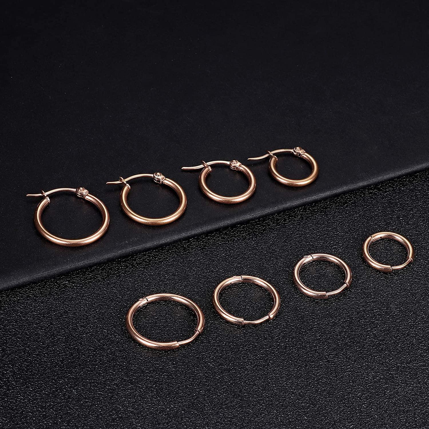 Presenting the Stainless Hoop Earrings Set for Women and Men, featuring 16 gold-plated silver-tone rounded earrings beautifully arranged in four rows. This versatile collection includes small cute huggie hoops to larger hoop earrings, making it an ideal gift for those who love to accessorize with elegance and style.