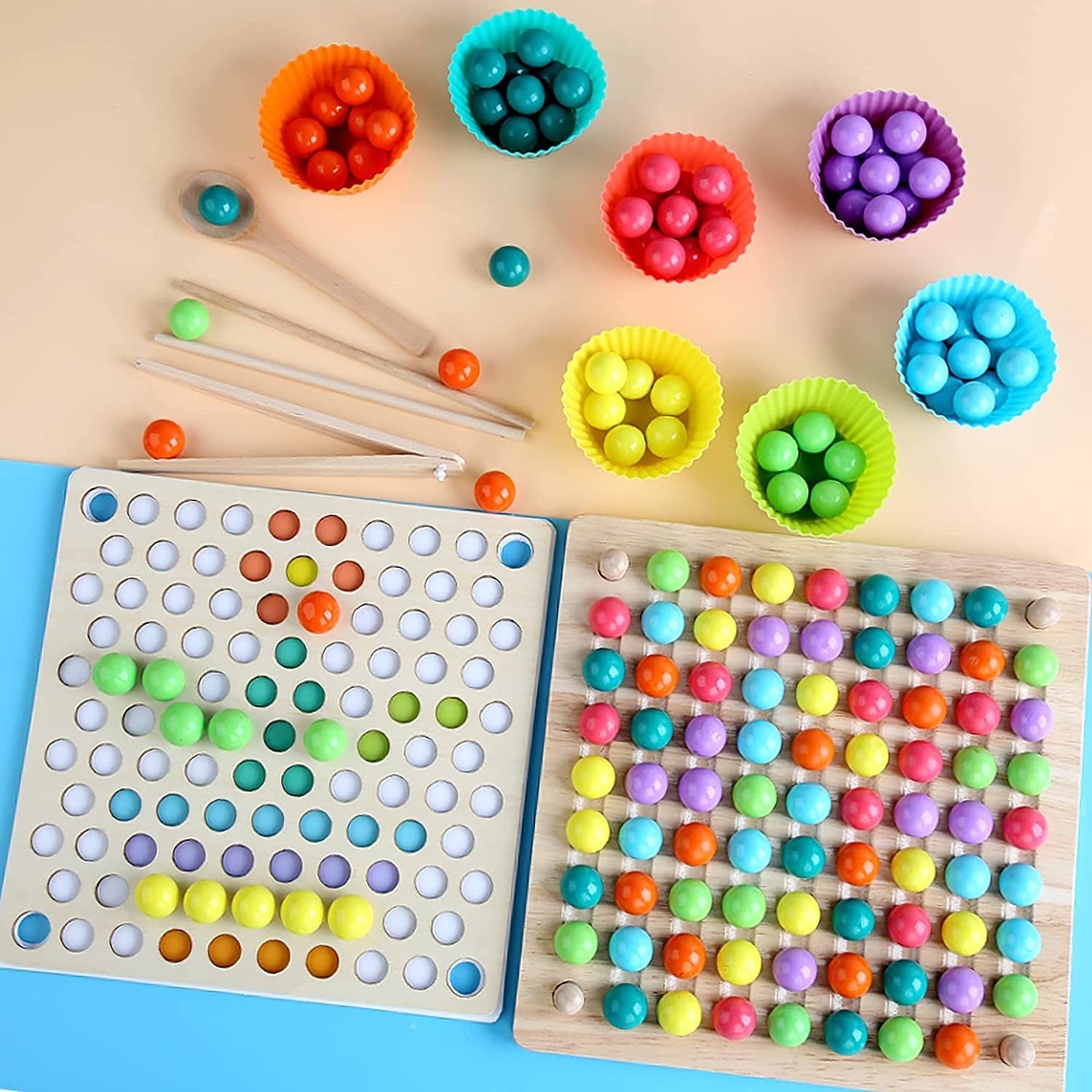 A colorful board game with colorful balls and sticks.
