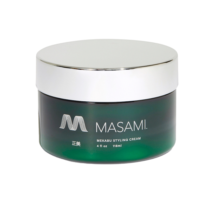 Container of MASAMI Mekabu Hydrating Styling Cream with a blue-green gradient design and silver lid, displaying the brand logo and product information. It is non-greasy.