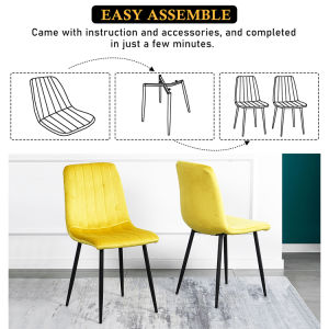 A modern dining room with a white table, four Indoor Velvet Dining Chairs with velvet fabric, and a gray rug, against a blue and white wall with minimalistic artwork.