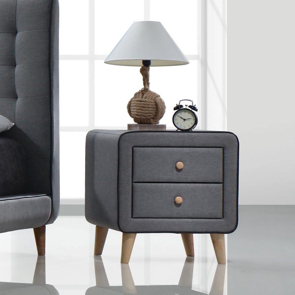 A Valda Nightstand in Light Gary Fabric YJ with two drawers and a clock.