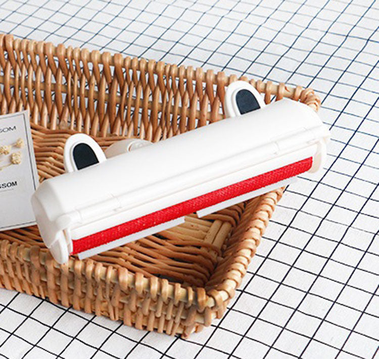 A wicker basket with a Pet Hair Cleaning Tool Useful Cloth Furniture White Lint Roller Dog Cat Hair Remover Rollers for removing pet hair.