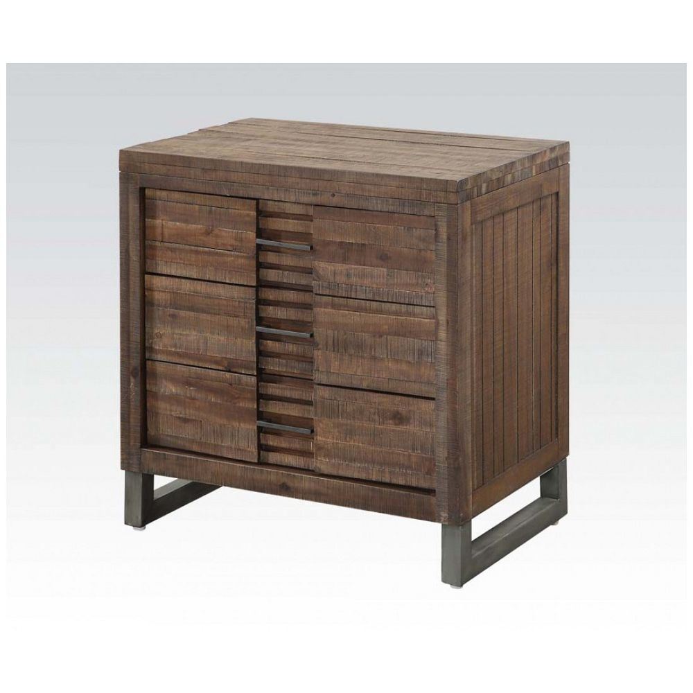 The Andria Nightstand in Reclaimed Oak YJ features metal legs and drawers, creating a transitional feel to your bedroom decor.