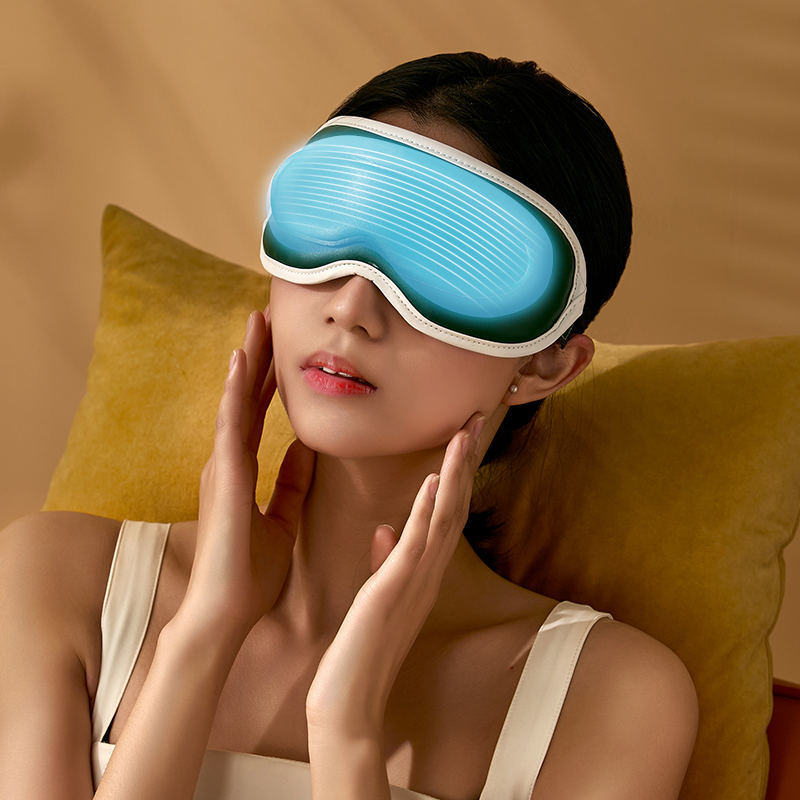 A modern green and white ergonomic New Tech Eye Massager Graphene Heating Eye Mask Dual-frequency Vibration Hot And Cold Double Compress Sleep Lunch Break Eye Mask with adjustable settings on a simple green background featuring eye fatigue relief.