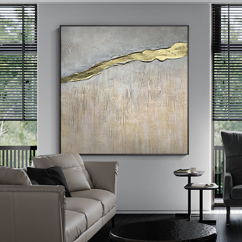 Large Hand Painted Texture Abstract Oil Painting Gold Foil in a modern interior, featuring a textured grey backdrop with a golden streak, accompanied by a small wooden stool.