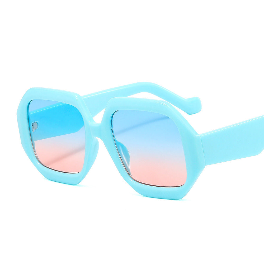 A pair of Fashion Square Polygonal Sunglasses Women Large Sunglass Vintage Sun Glass Men Luxury Brand Design Eyewear UV400 Gradient Shades with UV blocking, pink-tinted lenses isolated on a white background.