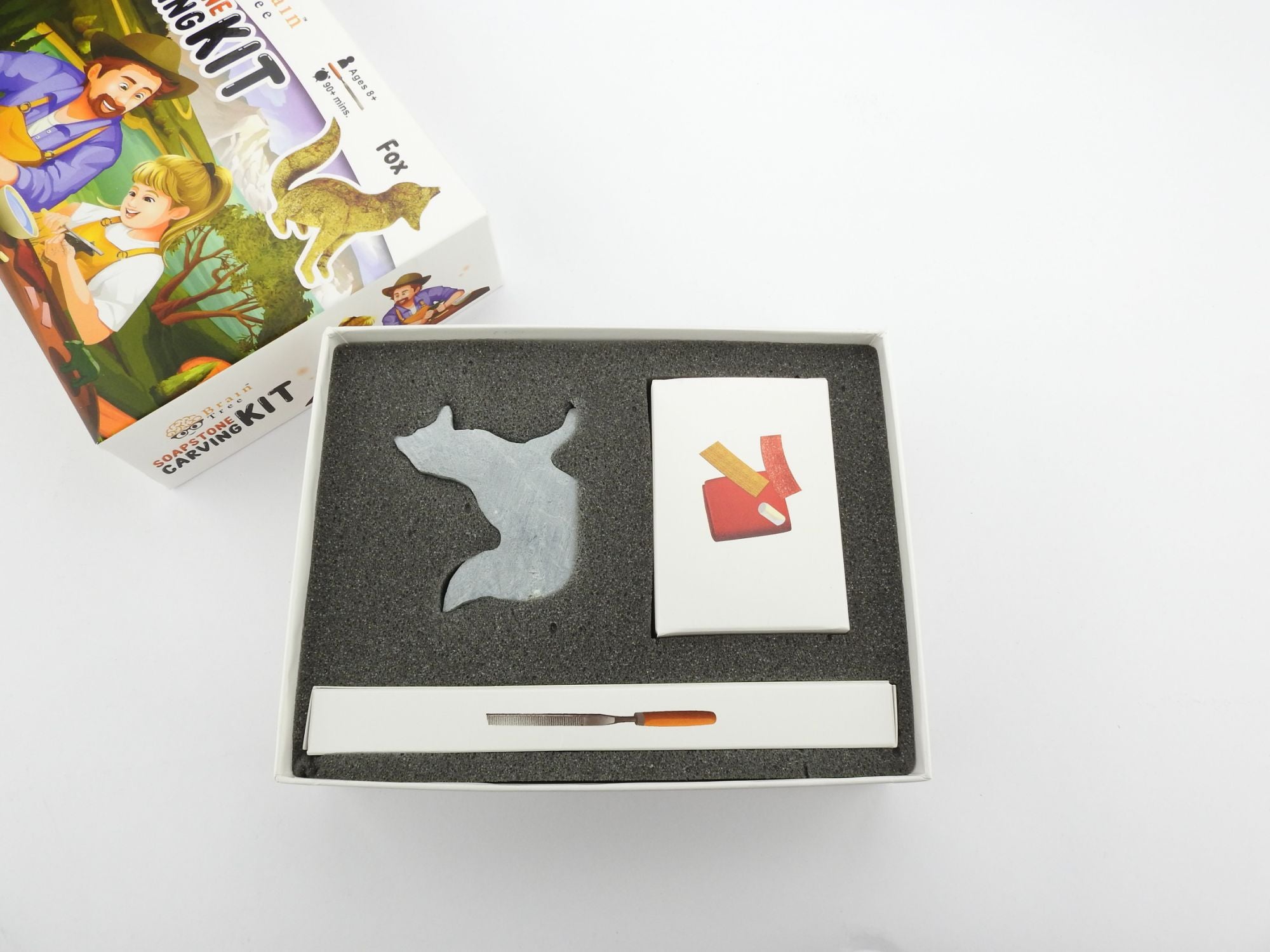 The Fox Soapstone Carving Kit: Safe and Fun DIY Craft for Kids and Adults has a picture of a man and a woman.