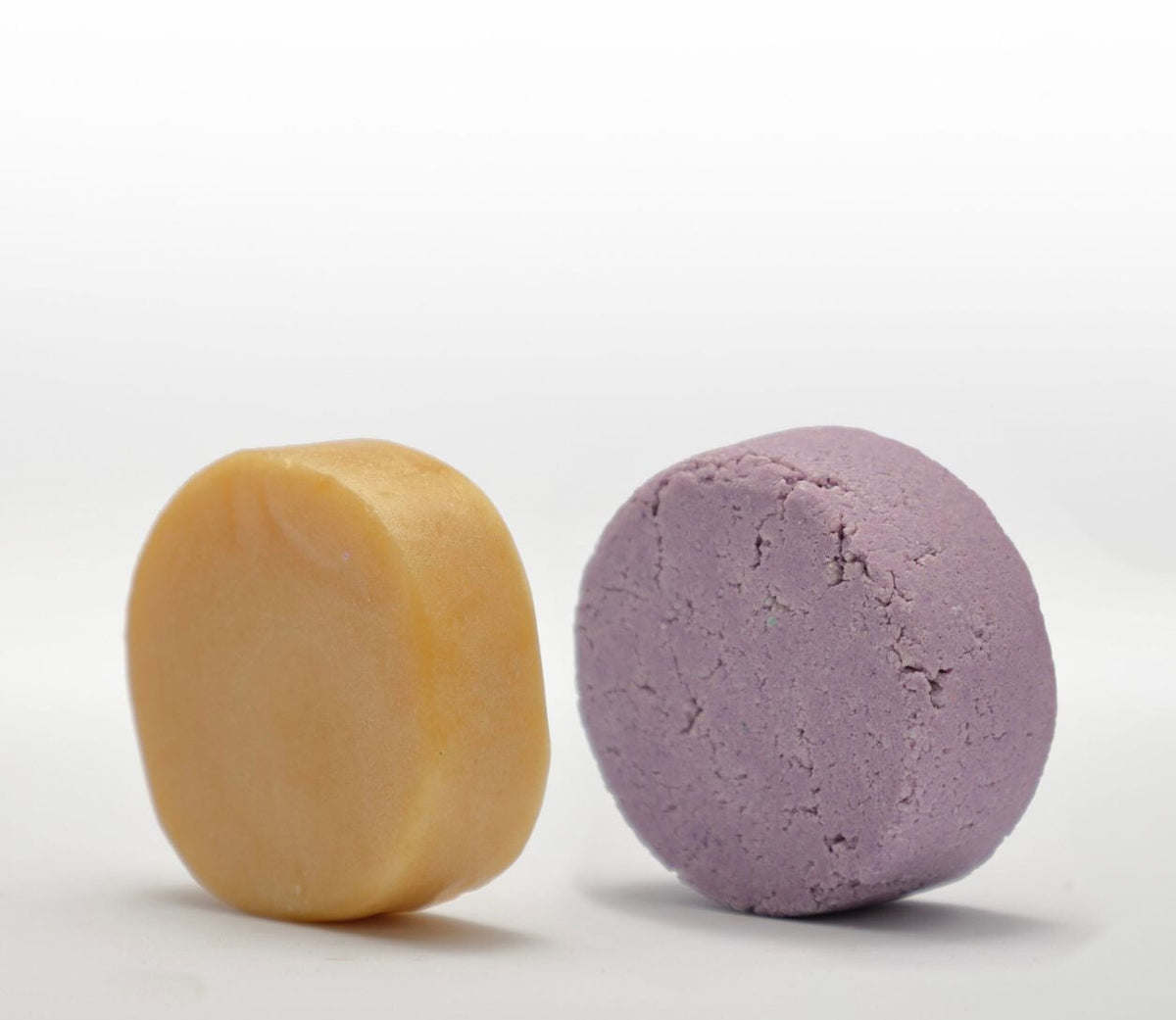 Two Shampoo Bar & Conditioner Bar Bundles on a white surface.