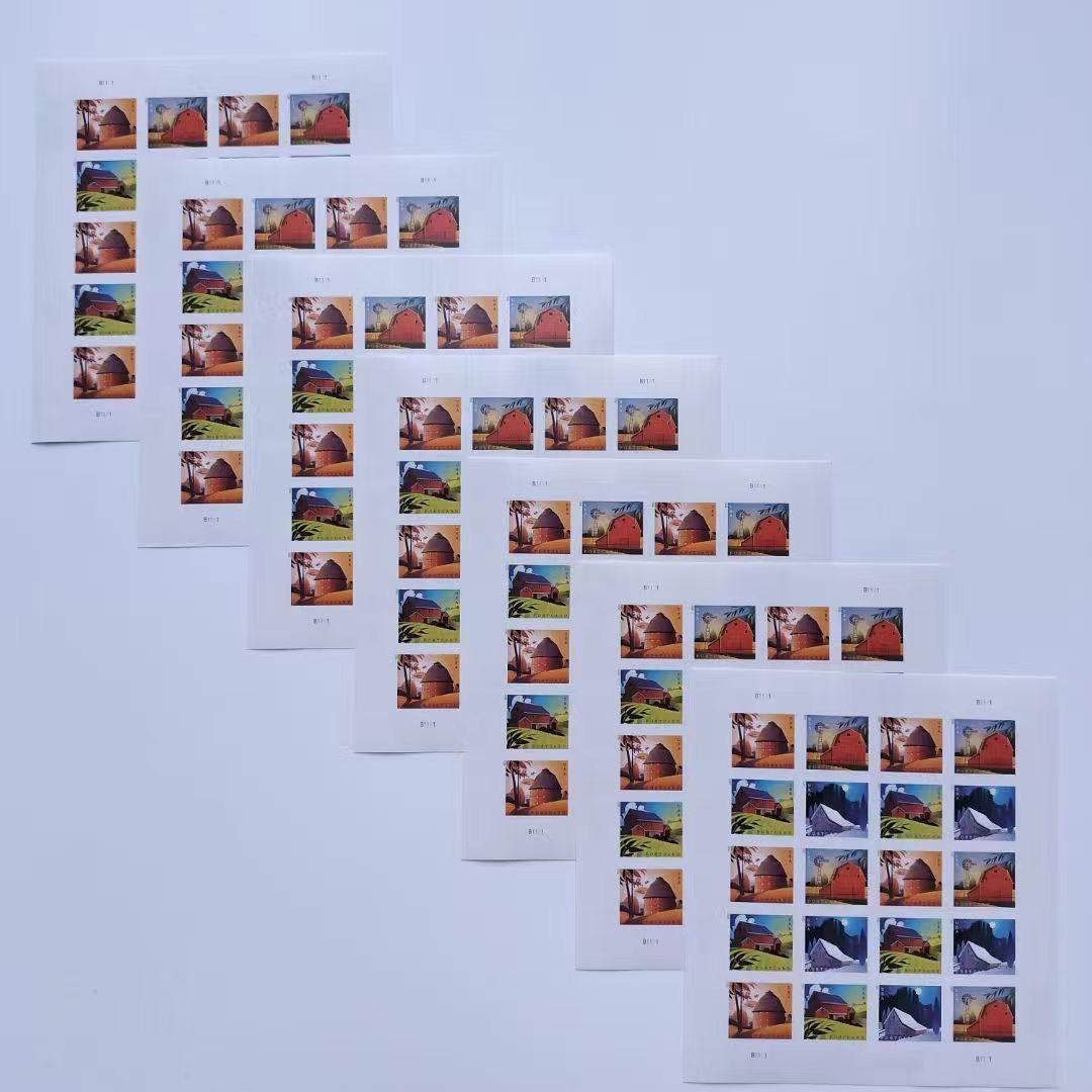 A collection of five Barn Postcard 2021 - 5 Sheets / 100 Pcs fanned out on a white surface, featuring various colorful wildlife images from 2021.