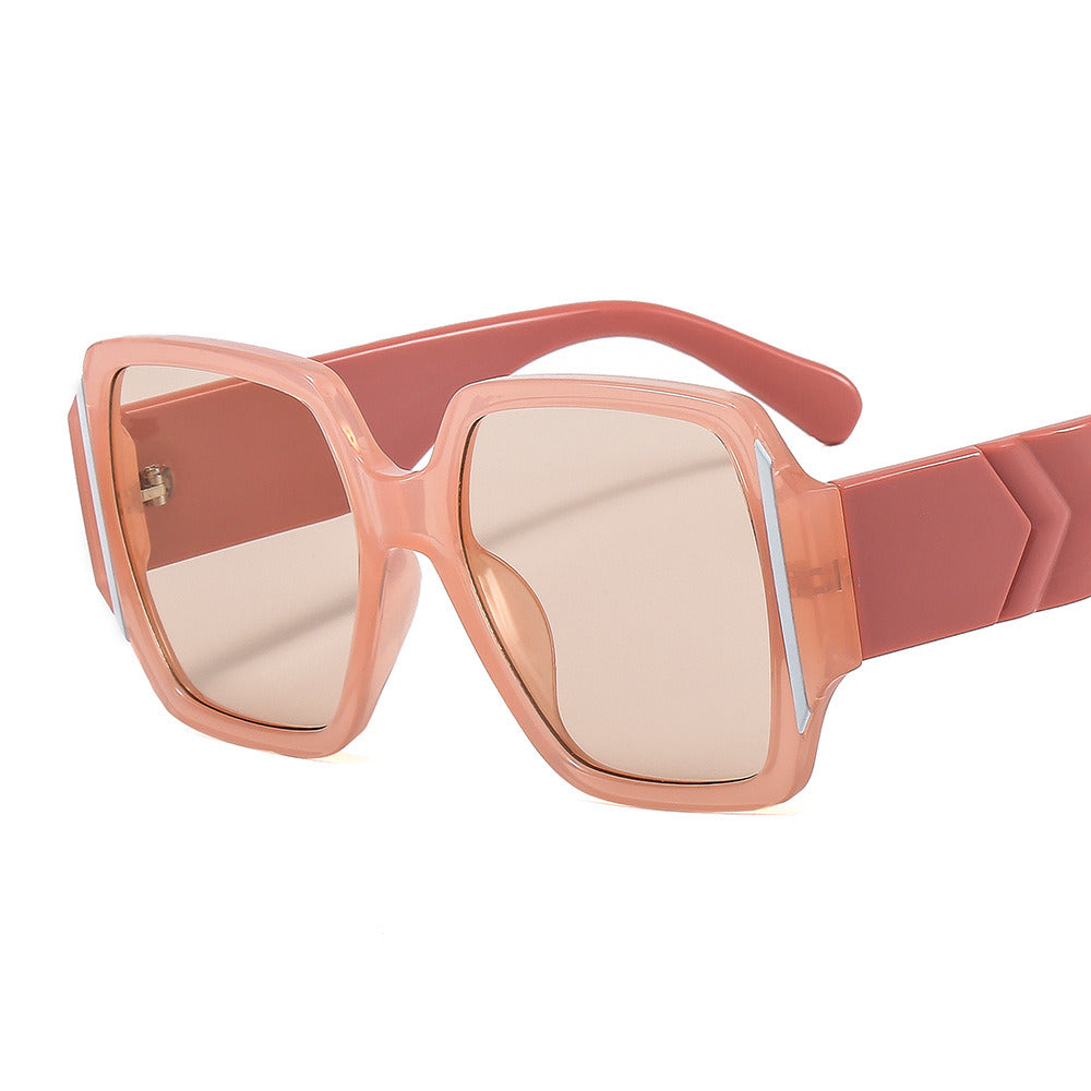 A pair of oversized, pink square-framed women's sunglasses Fashion Women Square Sunglasses Shades UV400 with thick arms, lying horizontally on a white background.