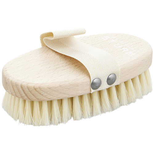 A Dr. Barbara Sturm by Dr. Barbara Sturm The Body Brush - Medium with natural bristles and a cream-colored strap, viewed from the side.