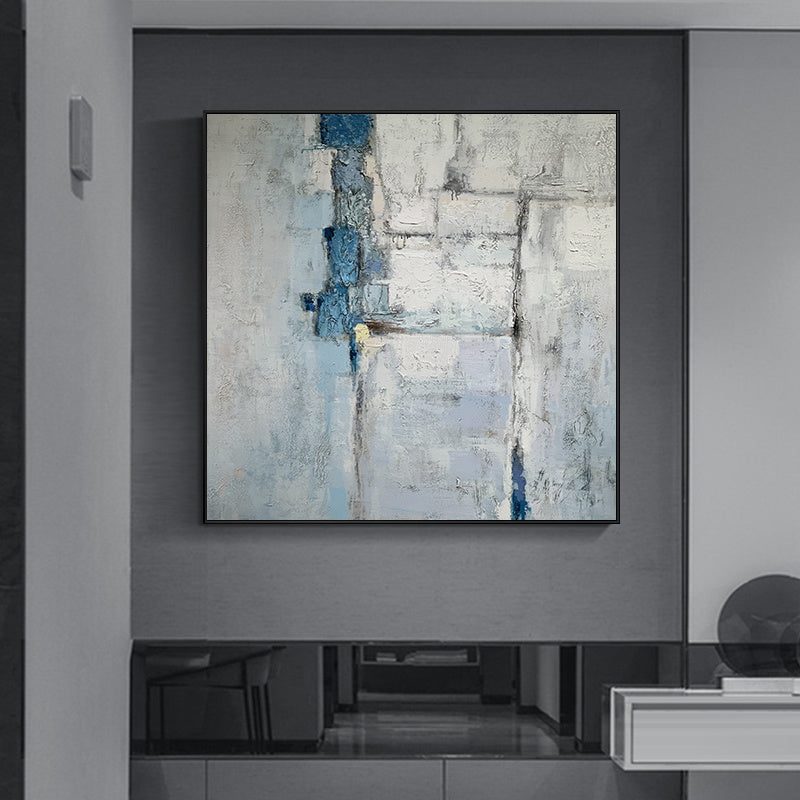 Abstract oil painting with blue and white tones hung on a Canvas Posters and Prints Gray Marble Prints Abstract Gold Line Nordic Wall Art Agate Painting Pictures For Living Room Decor in a modern room with minimalist furniture.