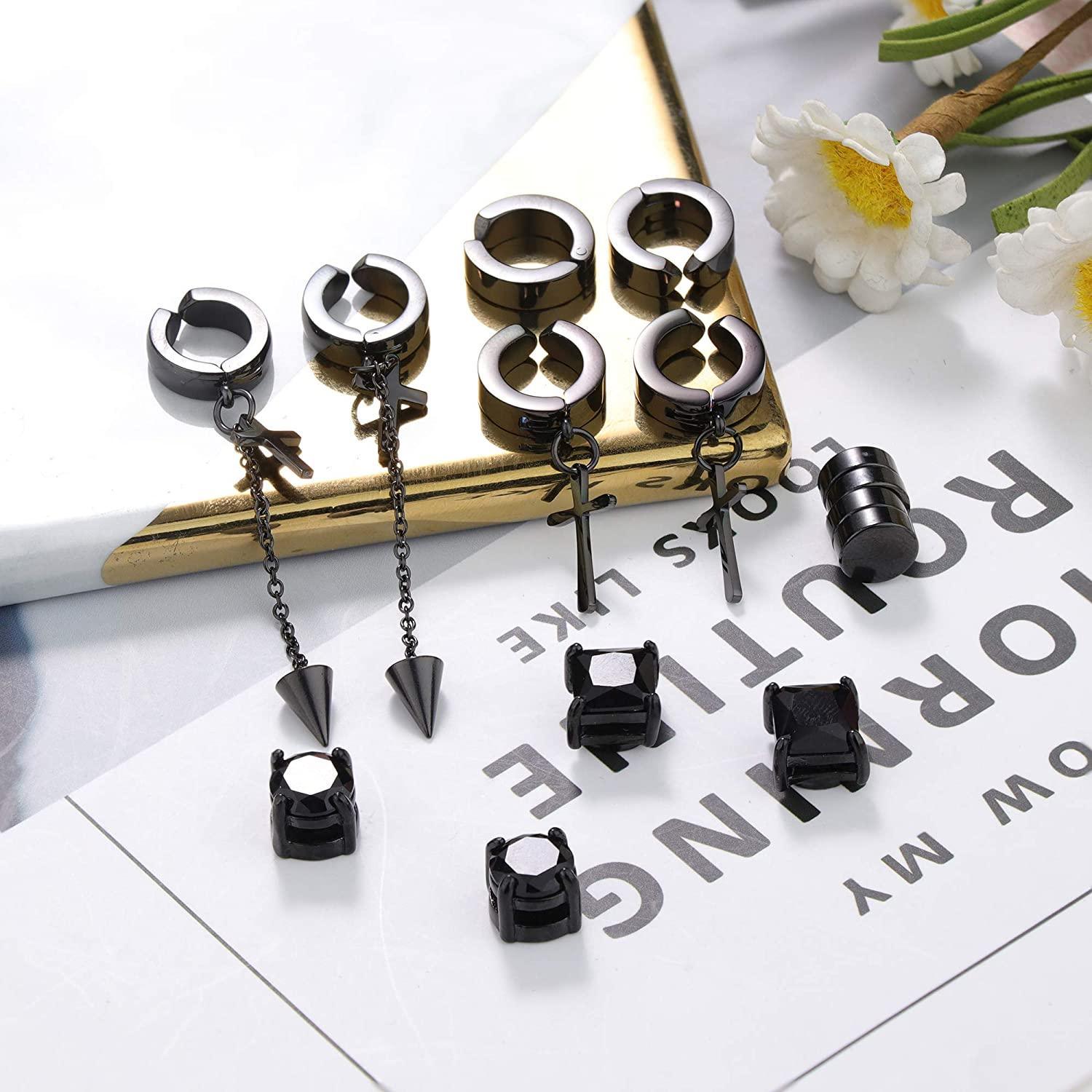 The Stainless Non Piercing Magnetic Earrings for Men and Women include a set of six pairs of high-quality, black earrings, featuring two pairs of studs, one pair of hoops with crosses, one pair of square-shaped studs, and one pair of hoops with chain crosses and pointed ends.