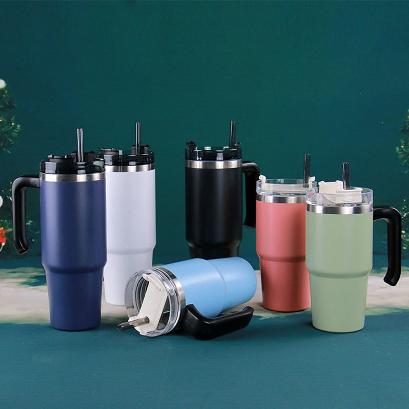 A black insulated 30oz travel car thermo mug with a stainless steel rim and handle, featuring a lid and a straw.