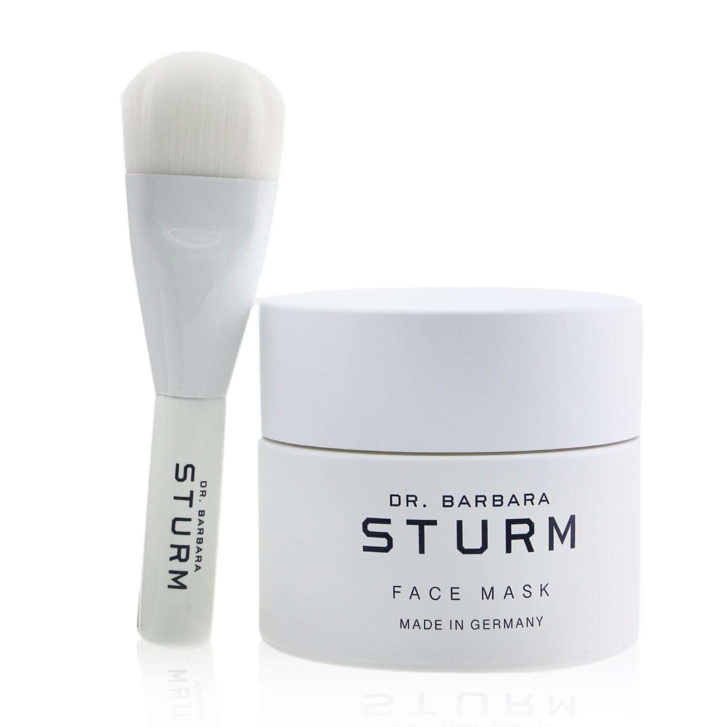 A DR. BARBARA STURM - Face Mask 33773/402160 50ml/1.69oz container with a white label next to a gray and white application brush, set against a white background.